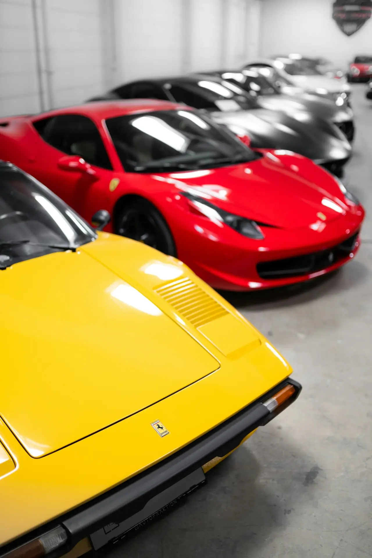 Red and Yellow Ferrari in a Showroom